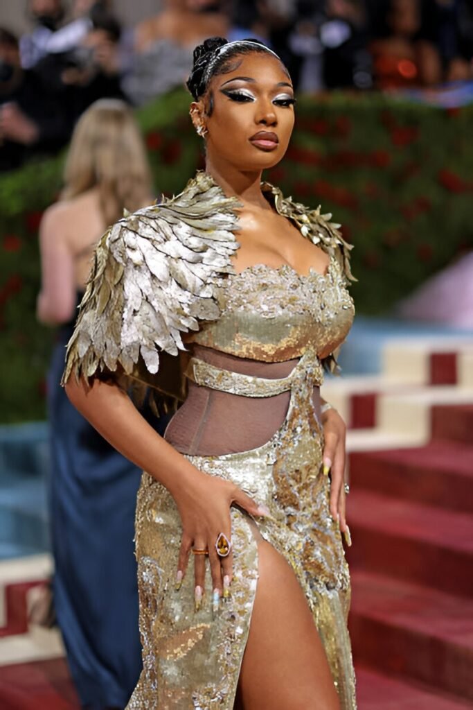 Gold Metallic Gown + Feathered Bolero Shrug + Dramatic Winged Eyeliner