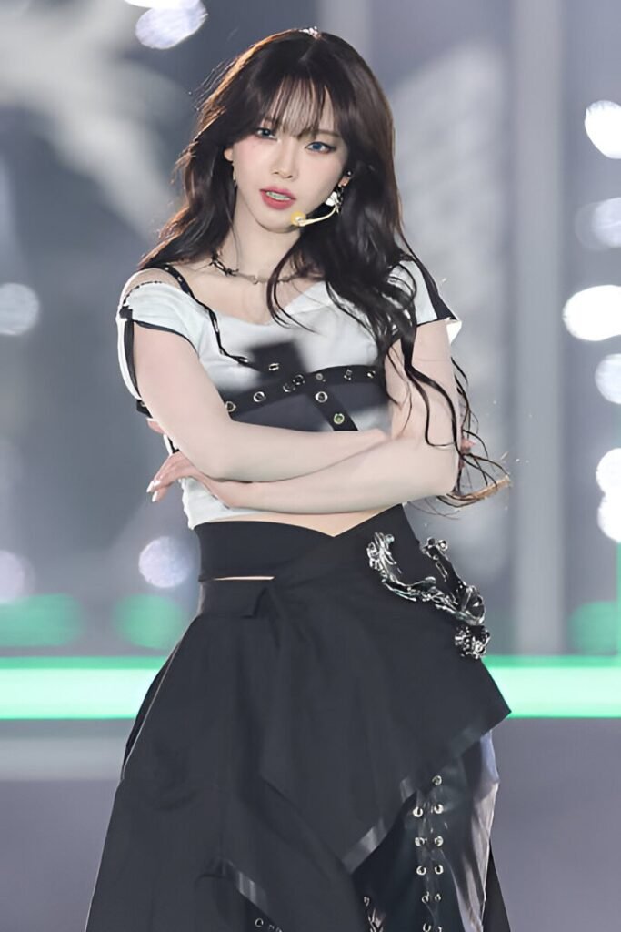 Graphic Crop Top + Black Asymmetrical Skirt + Silver Body Jewelry