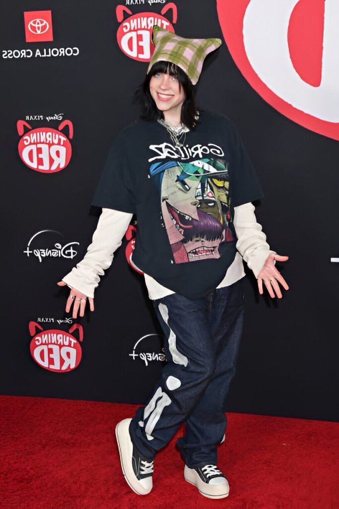 Green Plaid Beanie + Gorillaz Graphic Tee + Cream Long-Sleeve Undershirt + Skeleton Print Jeans + Black and White Platform Sneakers