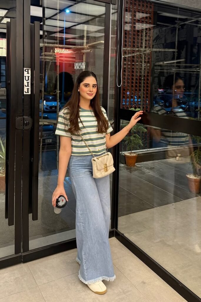 Green Striped T-Shirt + Light Blue Raw-Hem Wide-Leg Jeans + White Sneakers