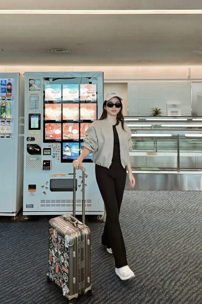 Grey Bomber Jacket + Black Top + Black Flared Leggings + White Sneakers
