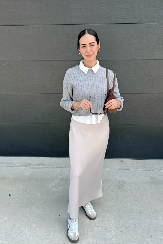 Grey Cable-Knit Cropped Sweater + White Collared Shirt + Champagne Satin Midi Skirt