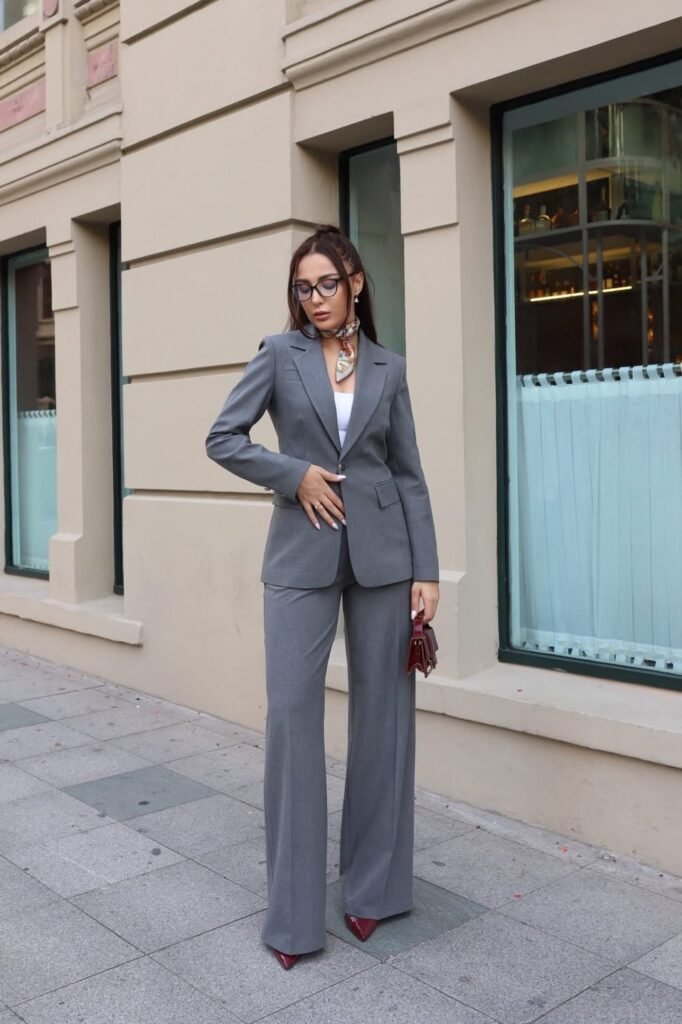 Grey Tailored Blazer + Matching Wide-Leg Trousers + Patterned Silk Neck Scarf + Burgundy Pointed-Toe Heels