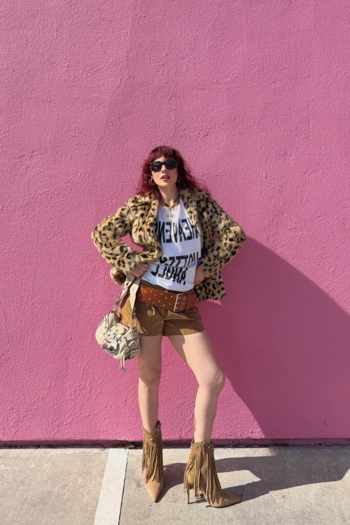 Leopard Print Faux Fur Coat + White Graphic T-Shirt + Brown Suede Shorts + Tan Fringed Stiletto Boots