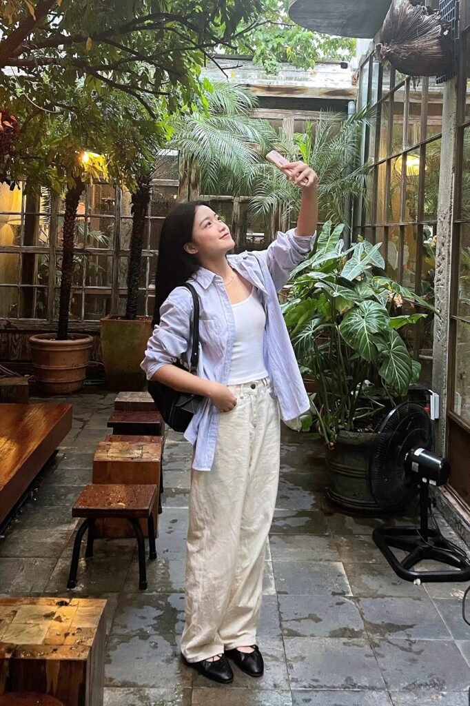 Light Blue Striped Button-Down + White Tank Top + Off-White Wide-Leg Trousers + Black Ballet Flats