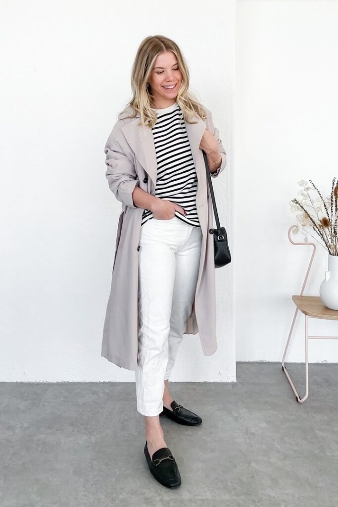 Light Grey Trench Coat + Black and White Striped Long Sleeve Tee + White Cropped Jeans + Black Horsebit Loafers
