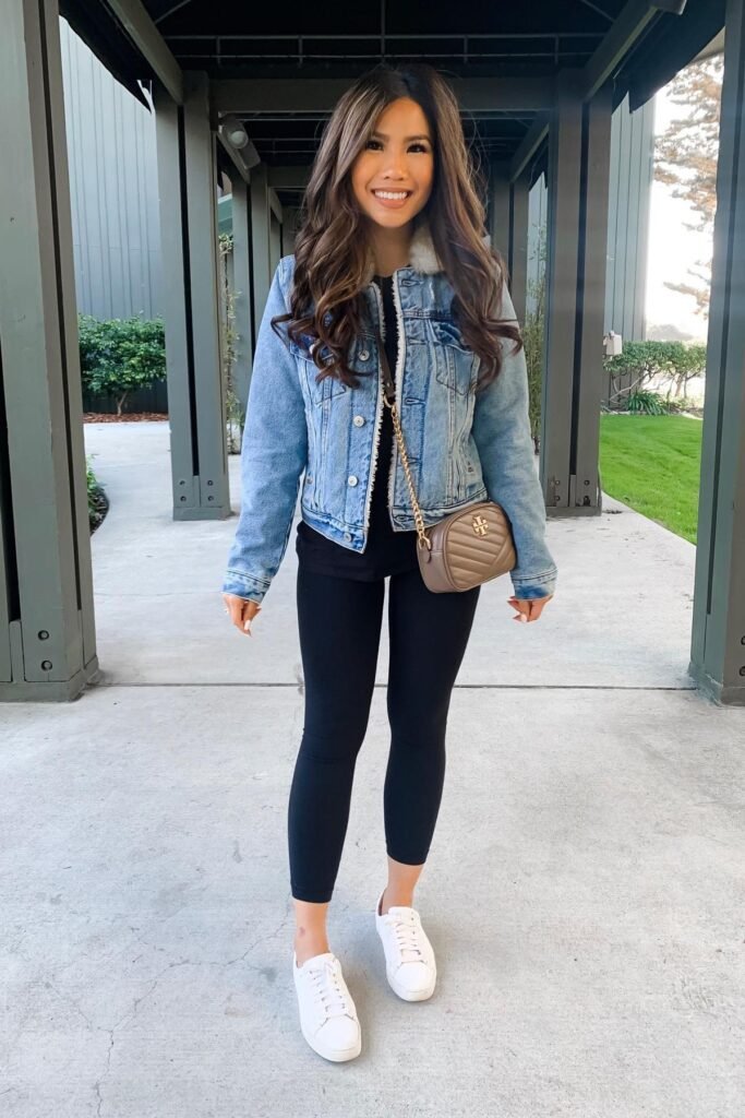 Light Wash Sherpa-Lined Denim Jacket + Black Tee + Black Cropped Leggings + White Leather Sneakers