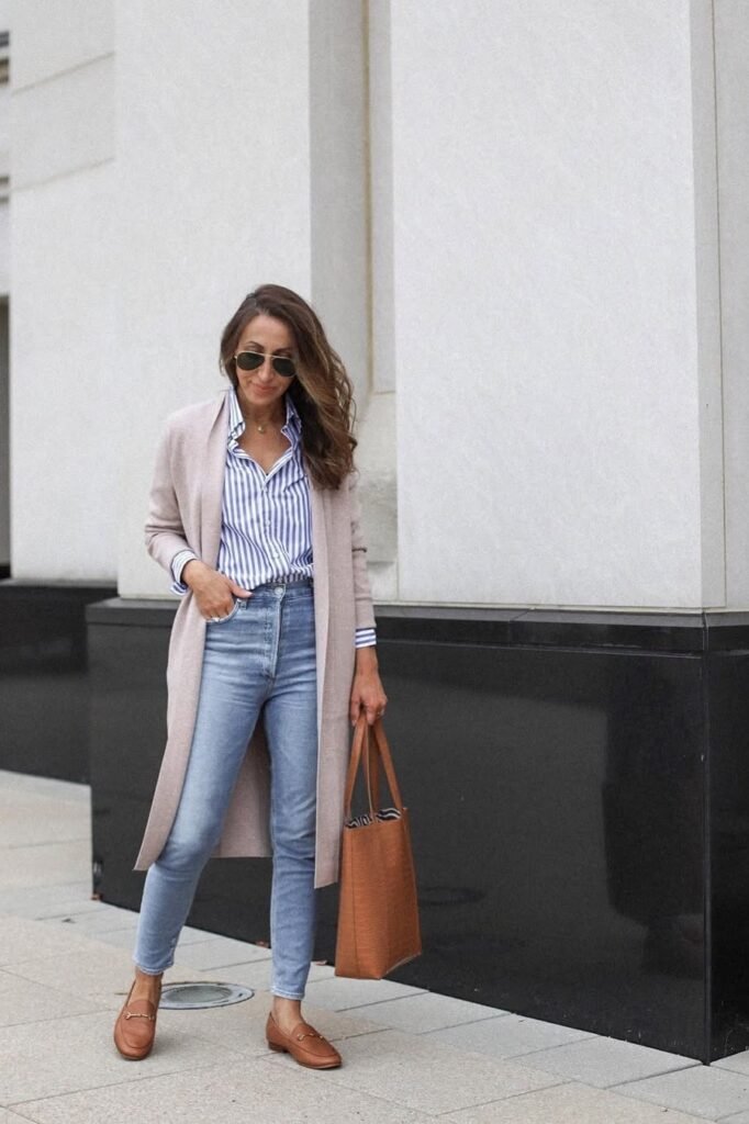Long Beige Cardigan + Blue and White Striped Shirt + Skinny Blue Jeans + Brown Leather Loafers