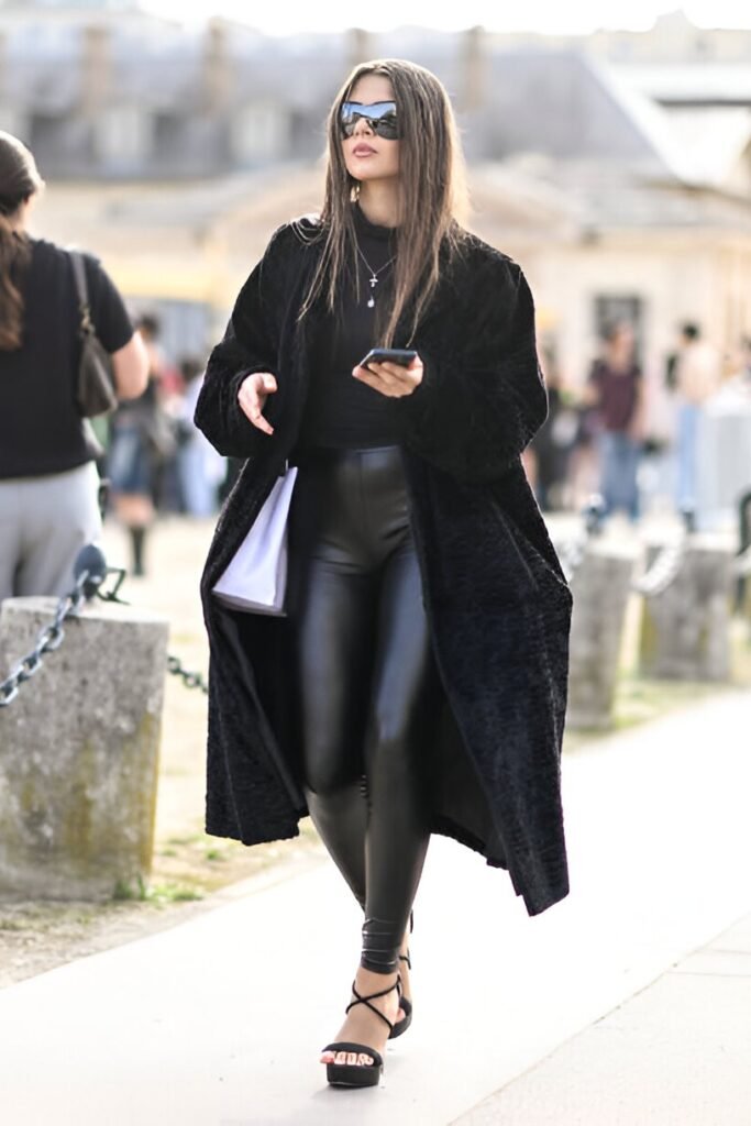 Long Black Textured Coat + Black Faux-Leather Leggings + Black Strappy Heeled Sandals