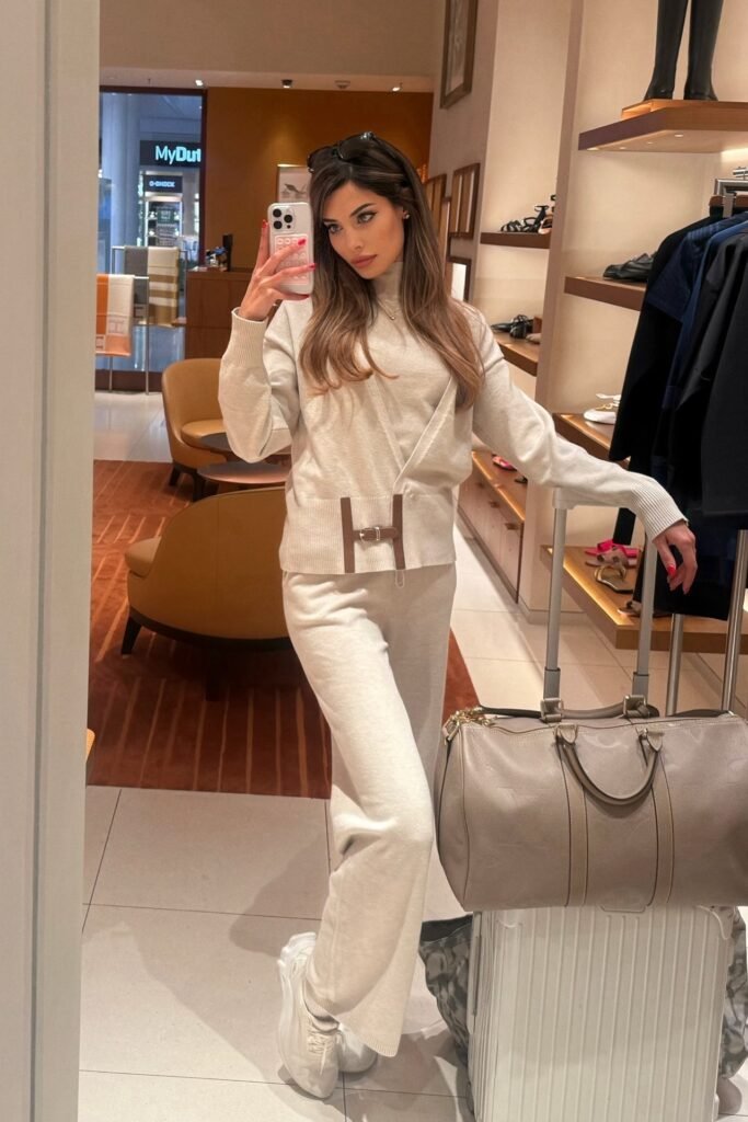 Monochrome Cream Knit Set + White Athletic Sneakers + Grey Leather Duffel Bag