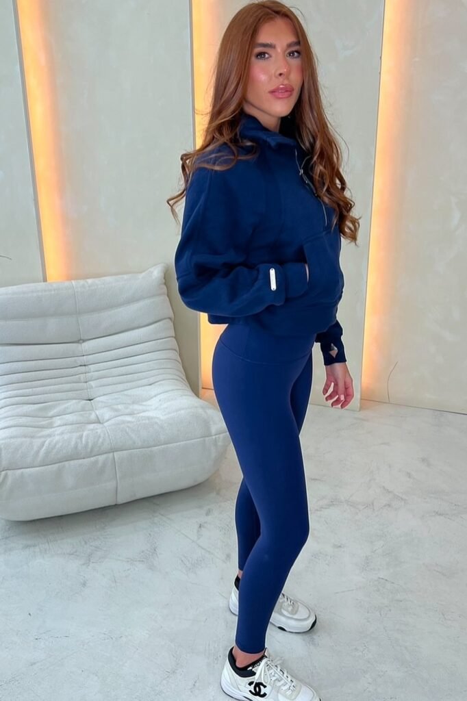 Navy Blue Quarter-Zip Sweatshirt + Matching Navy High-Waisted Leggings + White and Black Designer Sneakers