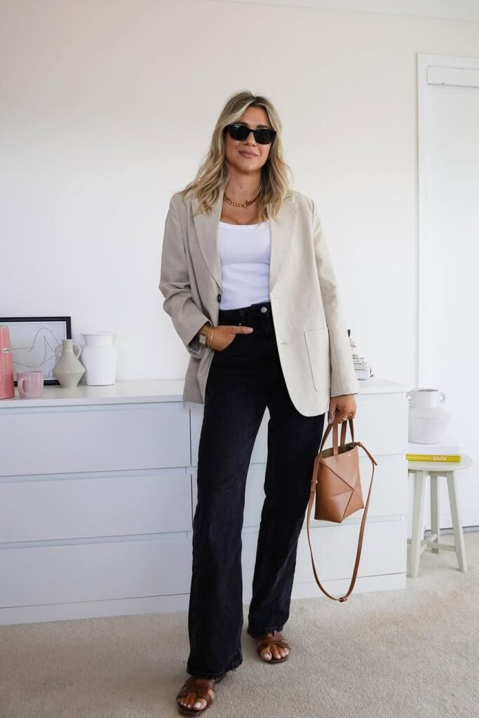 Oatmeal Oversized Blazer + White Ribbed Tank Top + Black Wide-Leg Jeans + Brown Leather Slides