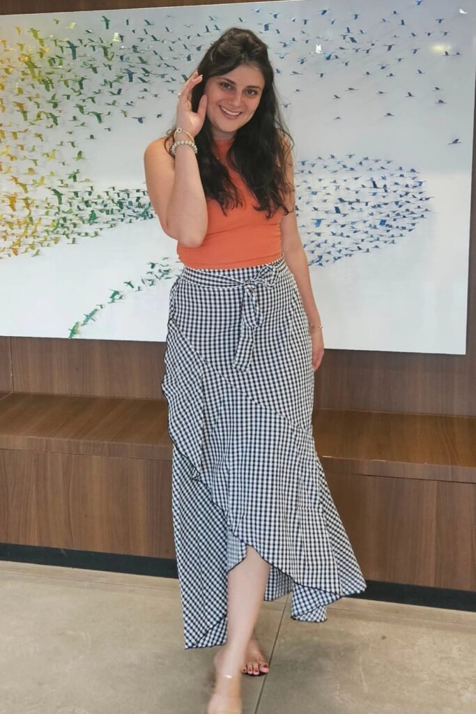 Orange Sleeveless Mock-Neck Top + Black and White Gingham Wrap Skirt + Clear Heeled Sandals