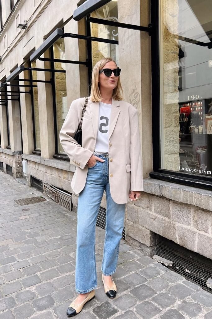 Oversized Beige Blazer + Graphic White T-Shirt + Light Wash Straight Jeans + Two-Tone Ballet Flats