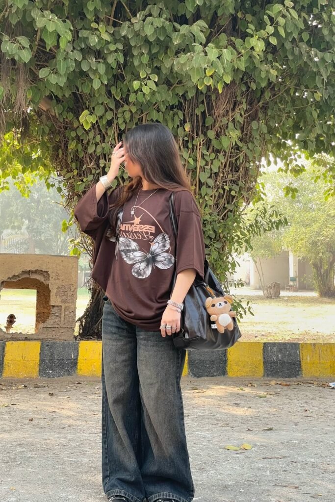 Oversized Brown Graphic Tee + Dark Wash Wide-Leg Jeans + Black Shoulder Bag