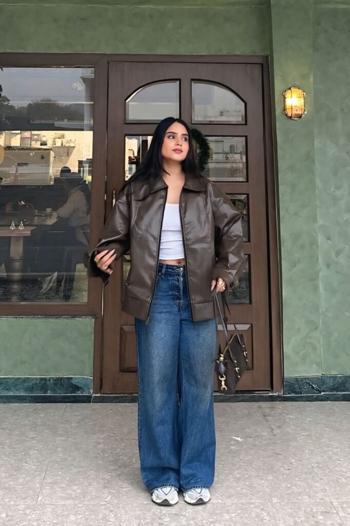 Oversized Brown Leather Jacket + White Crop Top + Baggy Blue Jeans