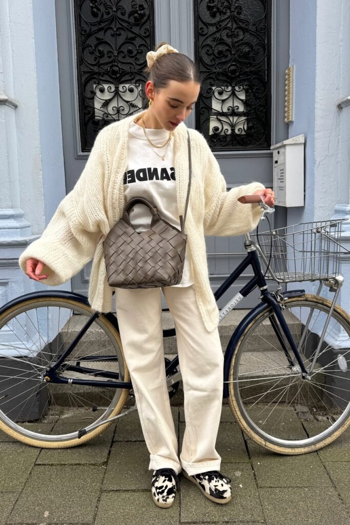 Oversized Cream Cardigan + Off-White Straight-Leg Jeans + Graphic White Sweatshirt + Cow-Print Shoes