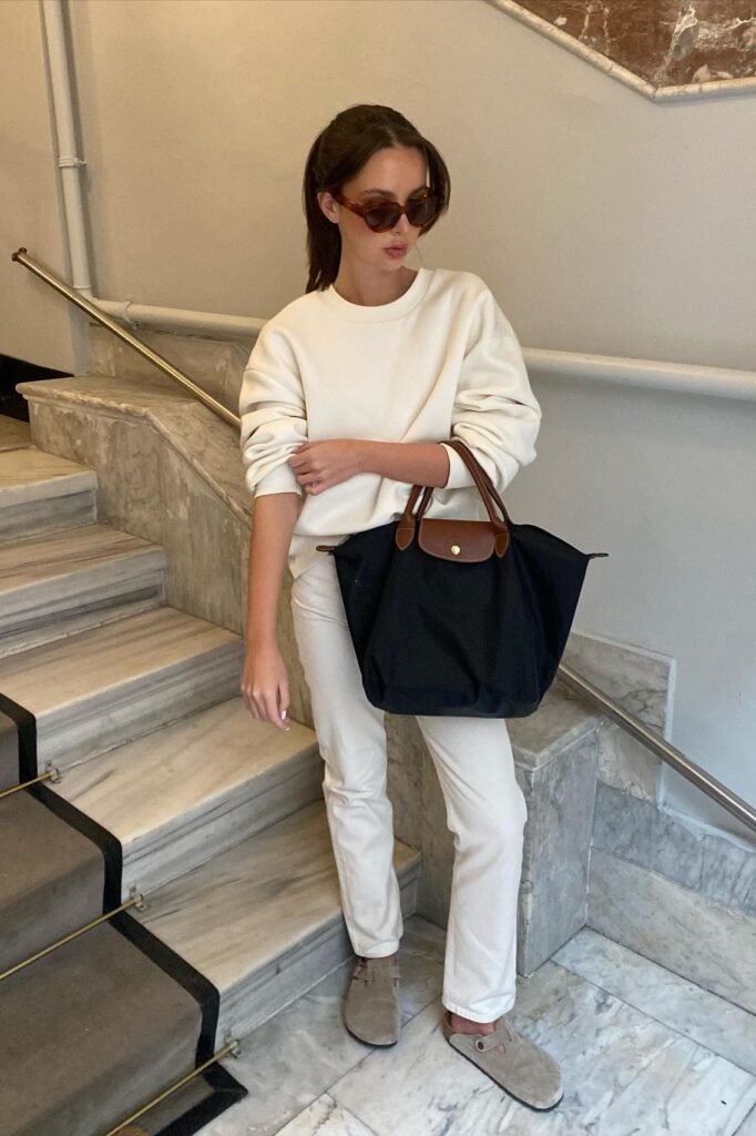 Oversized Cream Sweatshirt + Off-White Straight-Leg Jeans + Taupe Suede Clogs