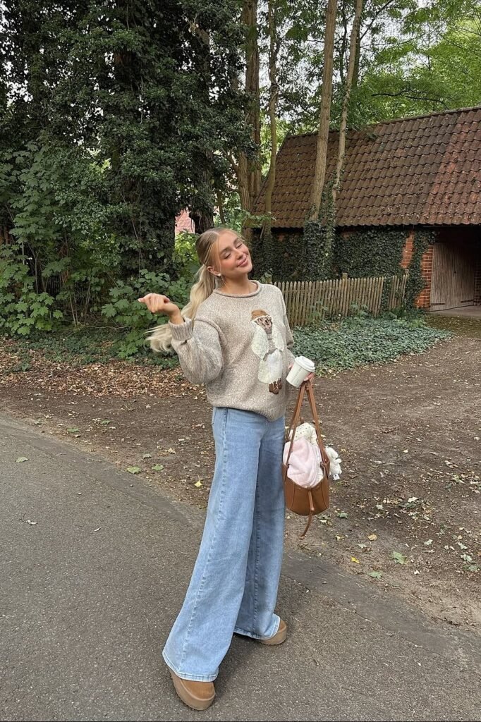 Oversized Graphic Beige Sweater + Light Wash Wide-Leg Jeans + Platform Tan Boots