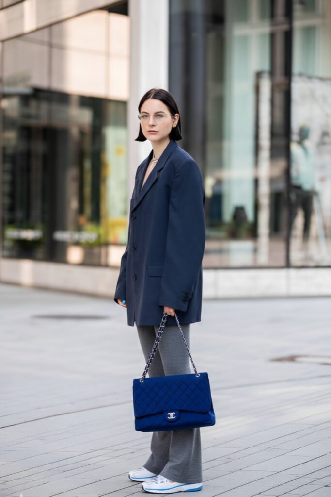Oversized Navy Blazer + Grey Flared Leggings + White and Blue Sneakers