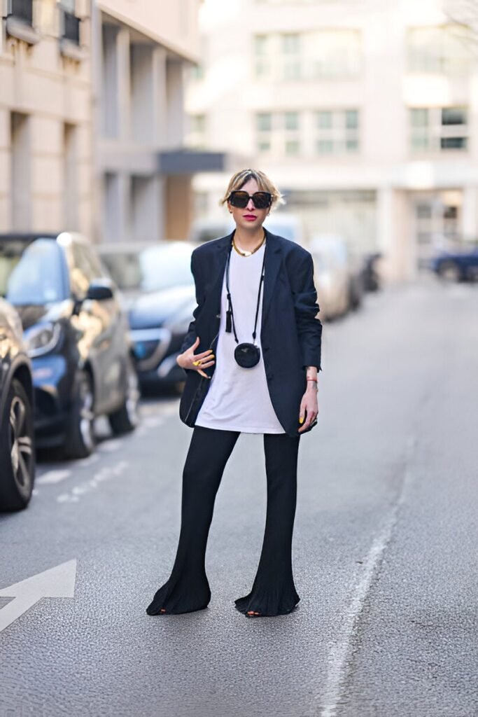 Oversized Navy Blazer & Long White T-Shirt + Black Ribbed Flared Trousers + Black Micro-Bag