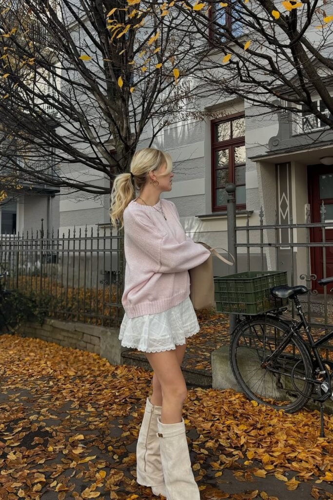 Oversized Pink Sweater + White Ruffled Mini Skirt + Cream Knee-High Boots