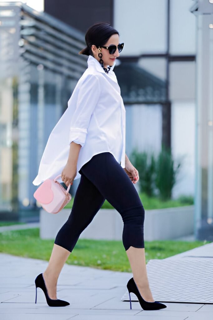 Oversized White Button-Down Shirt + Black Capri Leggings + Black Stiletto Pumps