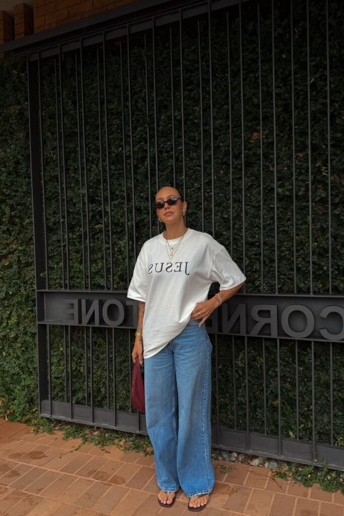 Oversized White Graphic T-Shirt + Wide-Leg Blue Jeans + Black Thong Sandals
