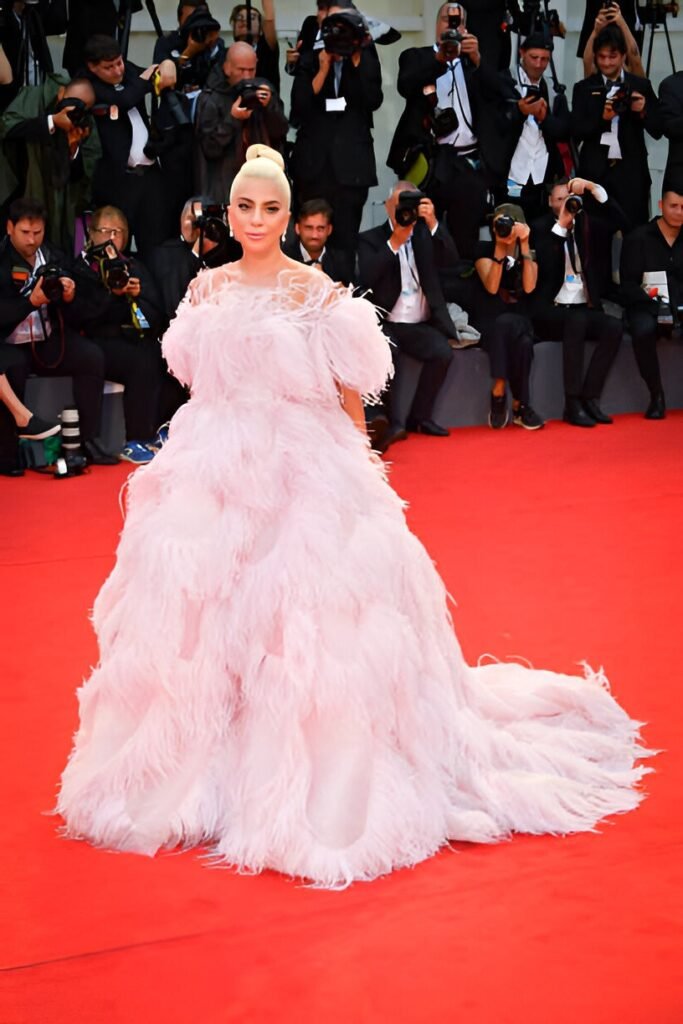 Pale Pink Voluminous Feathered Ballgown + Blonde High Bun