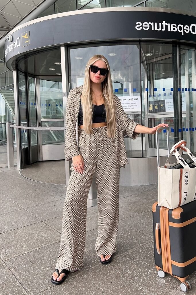 Patterned Beige and Black Button-Up Shirt + Black Crop Top + Matching Patterned Wide-Leg Pants + Black Platform Sandals