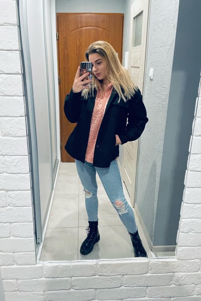 Pink Fleece Half-Zip + Black Shacket + Distressed Light-Wash Skinny Jeans + Black Combat Boots