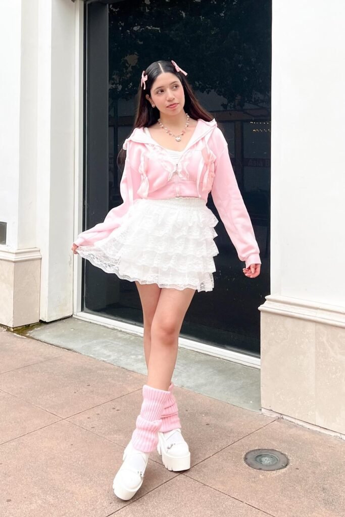 Pink Ruffled Zip-Up Hoodie + White Lace Tiered Mini Skirt + Pink Leg Warmers + White Platform Mary Janes