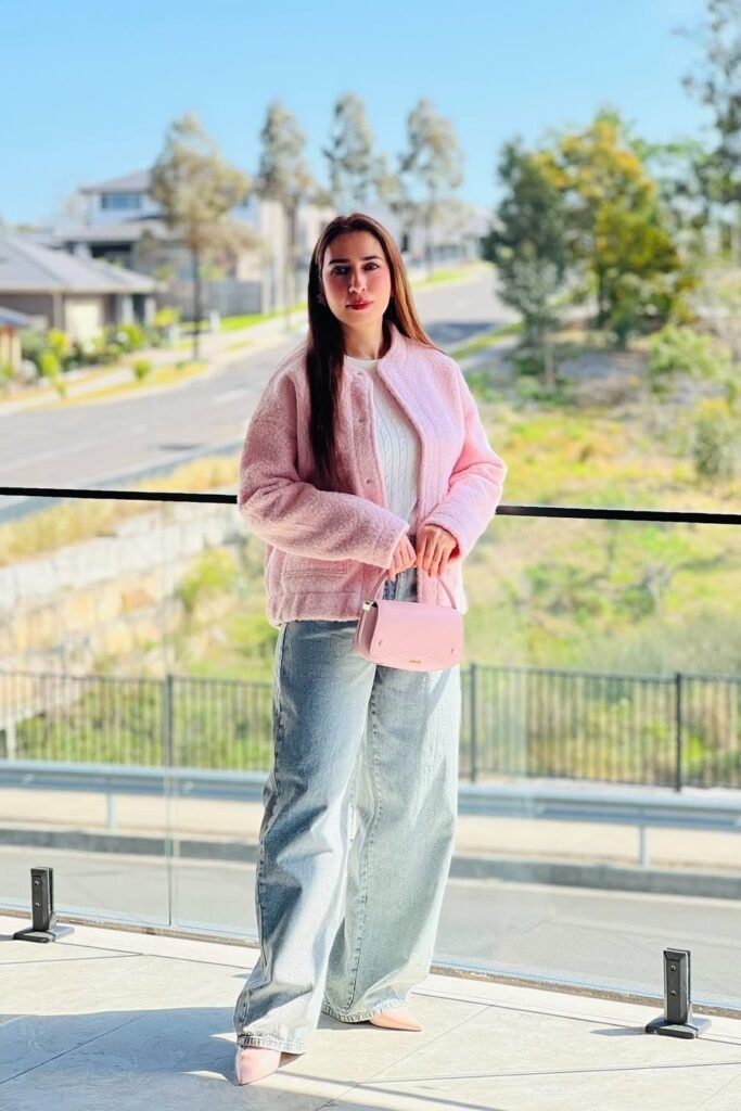 Pink Sherpa Jacket + White Cable-Knit Sweater + Light Wash Baggy Jeans + Nude Pointed-Toe Flats