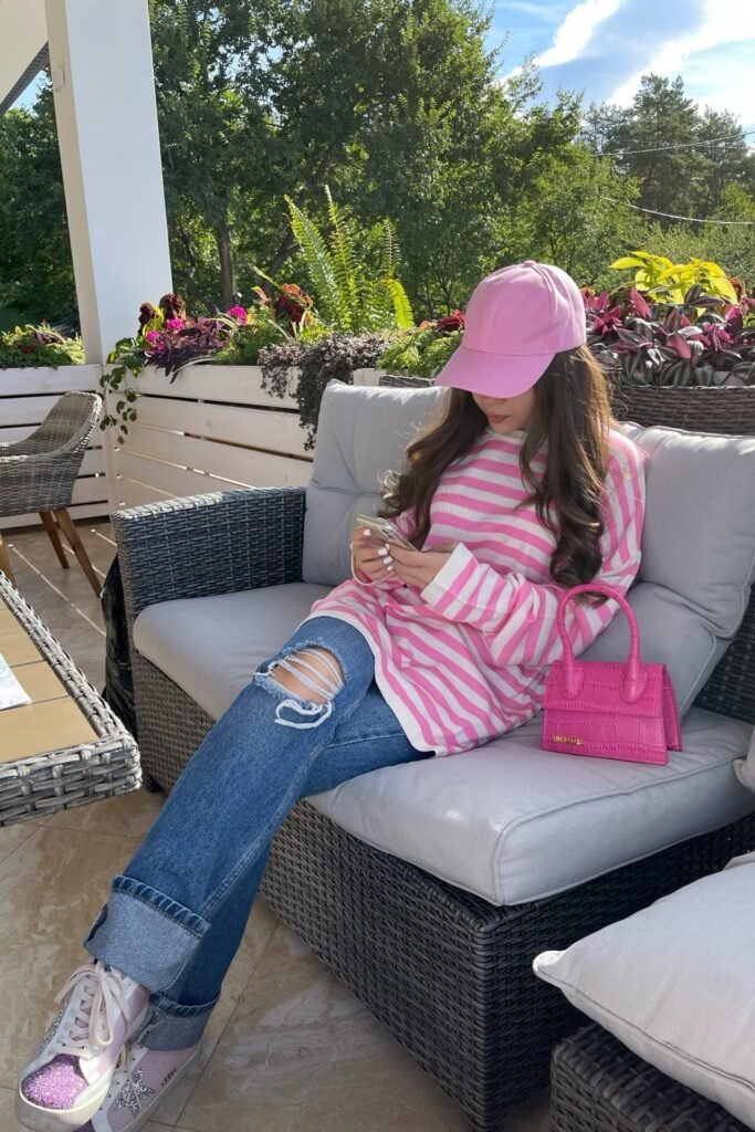 Pink and White Striped Long Sleeve + Ripped Blue Jeans + Pink Glitter Sneakers + Pink Cap