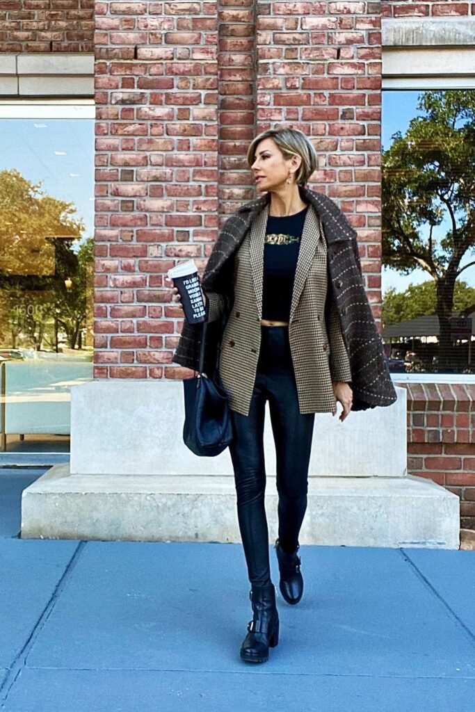 Plaid Blazer over Graphic Tee + Black Leather Leggings + Black Heeled Buckle Boots