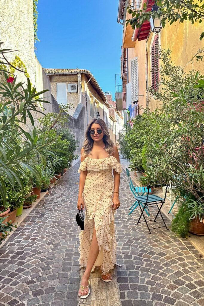 Polka Dot Off-the-Shoulder Ruffle Maxi Dress + Black Mini Bag + White Thong Sandals