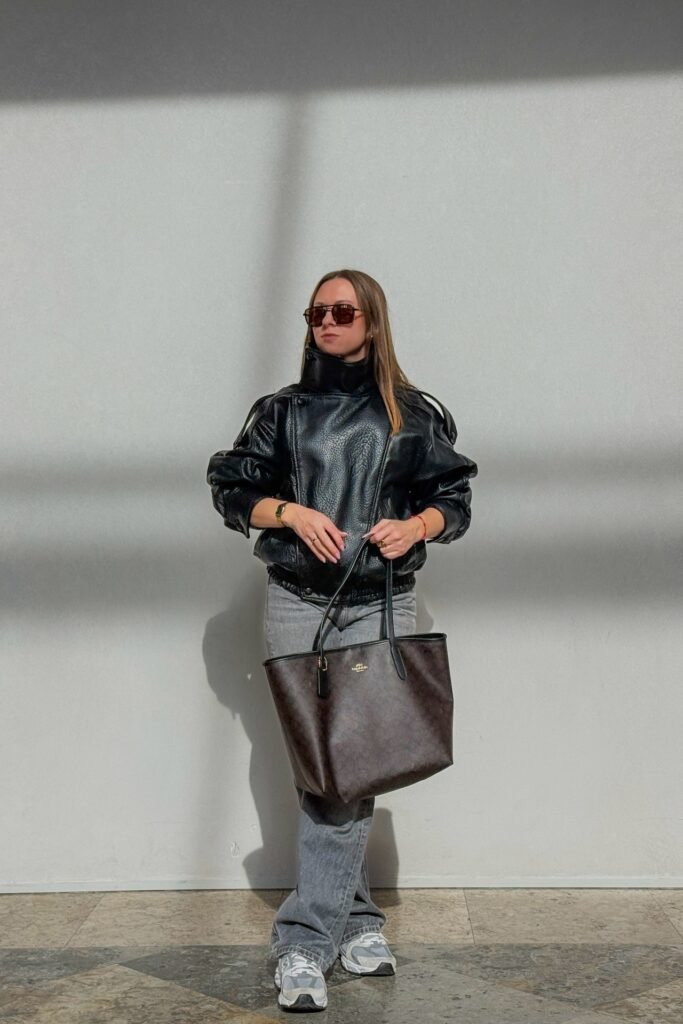 Puffy Black Leather Bomber + Grey Wide-Leg Jeans + Chunky Dad Sneakers
