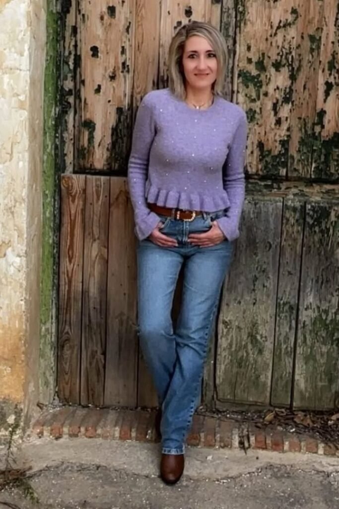 Purple Ruffle-Hem Sweater + Medium Wash Jeans + Brown Leather Belt + Brown Boots