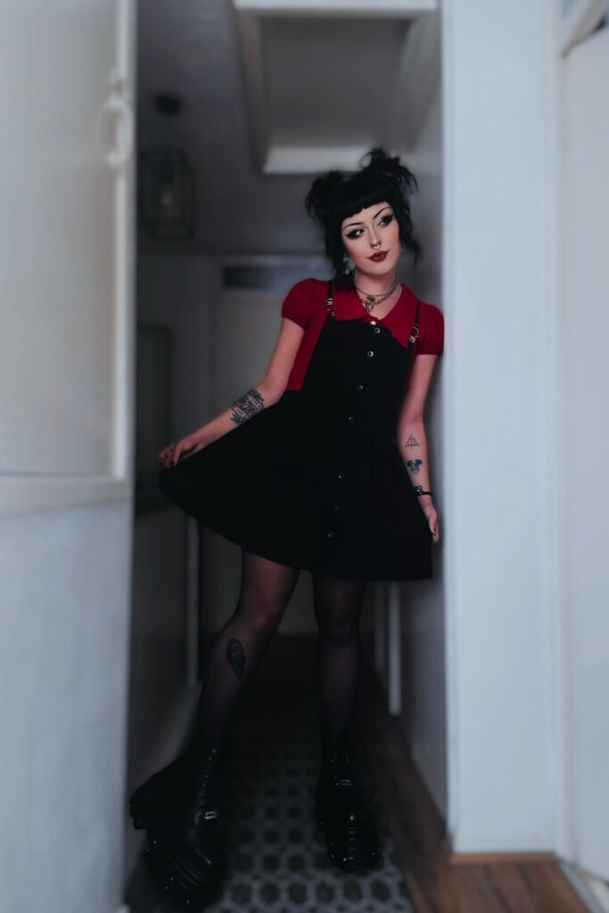 Red Puff-Sleeve Blouse + Black Button-Down Pinafore Dress + Platform Boots