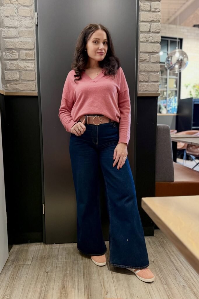 Rose Pink V-Neck Sweater + Dark Wash Wide-Leg Jeans + Pink Sneakers