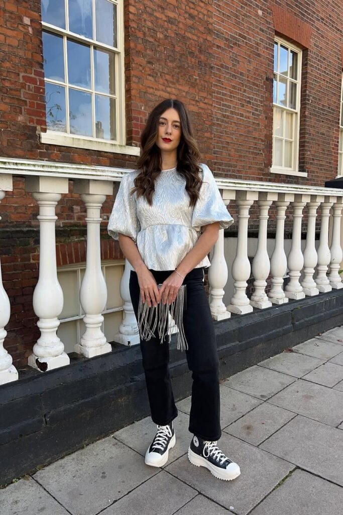 Silver Puff-Sleeve Blouse + Black Straight-Leg Jeans + Black and White Platform High-Top Sneakers