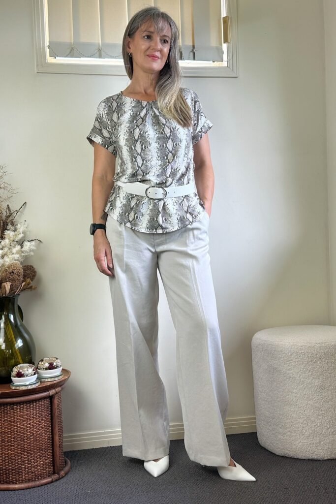 Snakeskin Print Short-Sleeve Blouse + Beige Wide-Leg Trousers + White Pointed-Toe Mules