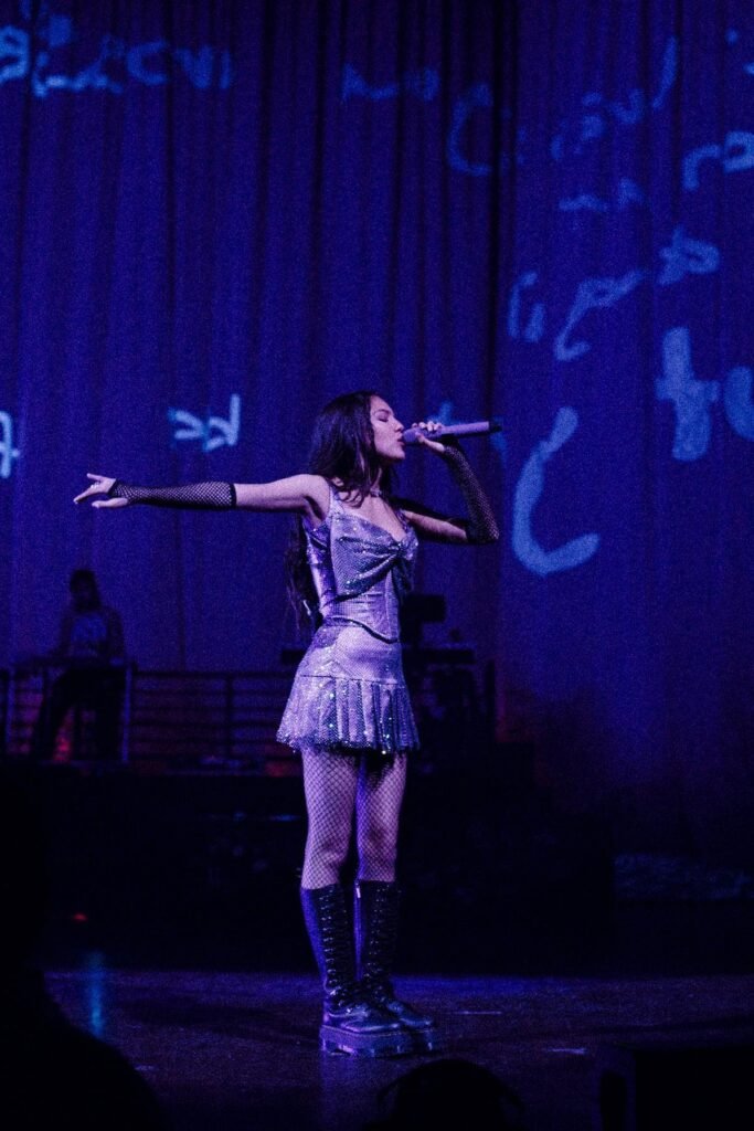 Sparkly Silver Corset Top + Matching Sequined Mini Skirt + Black Fishnets + Platform Combat Boots