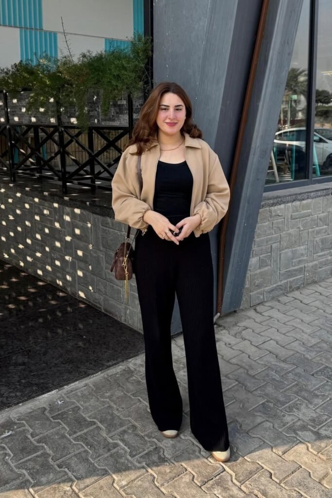 Tan Bomber Jacket + Black Bodysuit + Black Wide-Leg Trousers