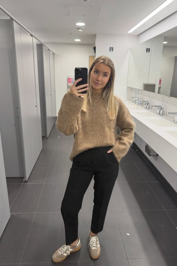 Tan Oversized Knit Sweater + Black Straight-Leg Pants + Brown Suede Sneakers