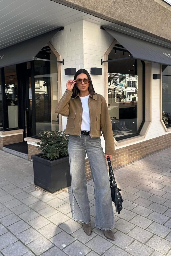 Tan Suede Cropped Jacket + White T-Shirt + Grey Wide-Leg Jeans + Brown Pointed Boots