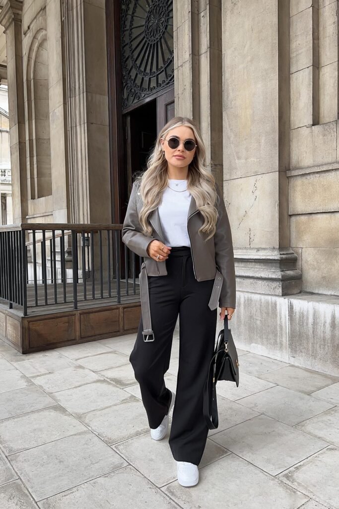 Taupe Grey Biker Jacket + White T-shirt + Black High-Waisted Wide-Leg Trousers + White Sneakers