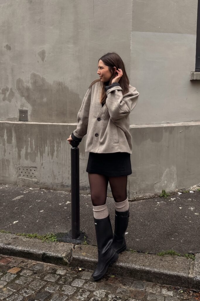 Taupe Wool Shacket + Black Mini Skirt + Sheer Black Tights + Tall Black Rain Boots with Beige Slouch Socks