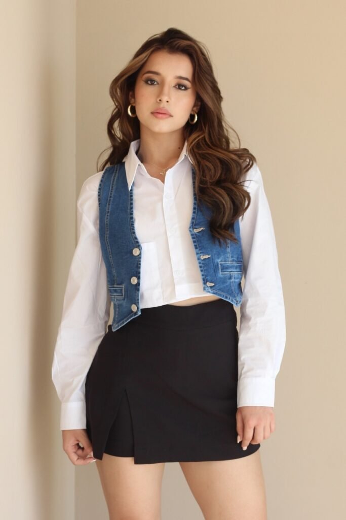 White Button-Down Shirt + Cropped Denim Vest + Black Mini Skort