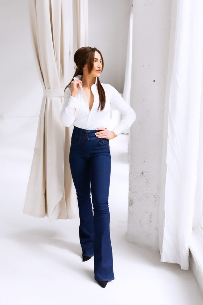 White Button-Down Shirt + High-Waisted Dark Wash Flare Jeans + Black Pointed Heels